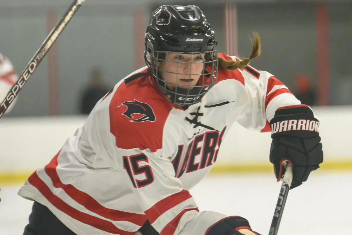Mikayla McCarvel playing for her high school hockey team in Minnesota.