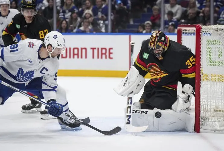 Maple Leafs captain John Tabares trying to score a goal against Vancouver Canucks' Thatcher Demko.