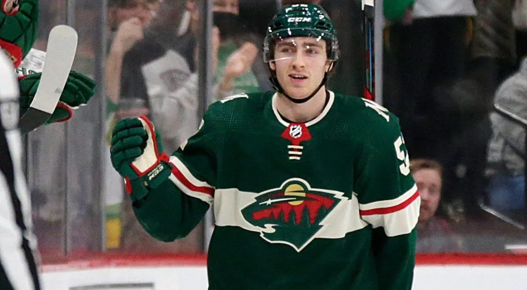 Former Wild forward Connor Dewar celebrating a goal during a home game in the NHL.