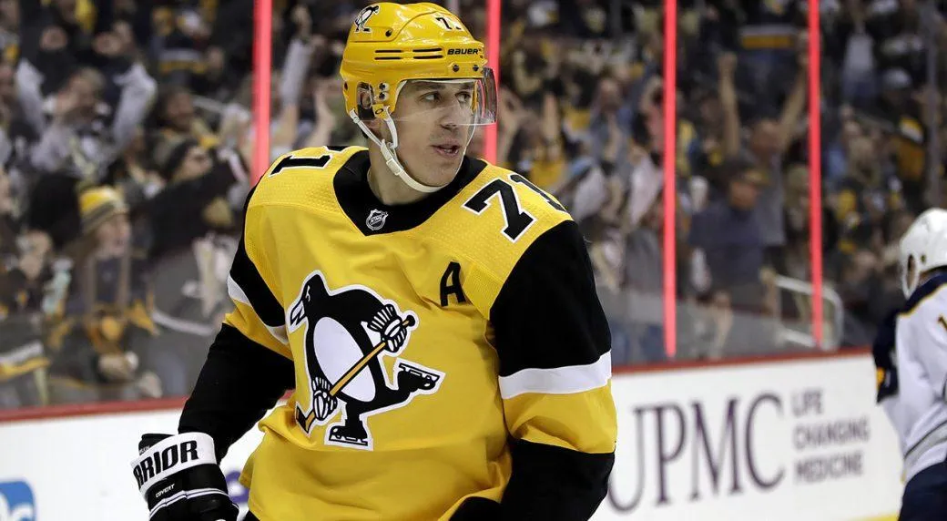 Pittsburgh Penguins forward Evgeni Malkin turning to face his teammates after scoring a goal