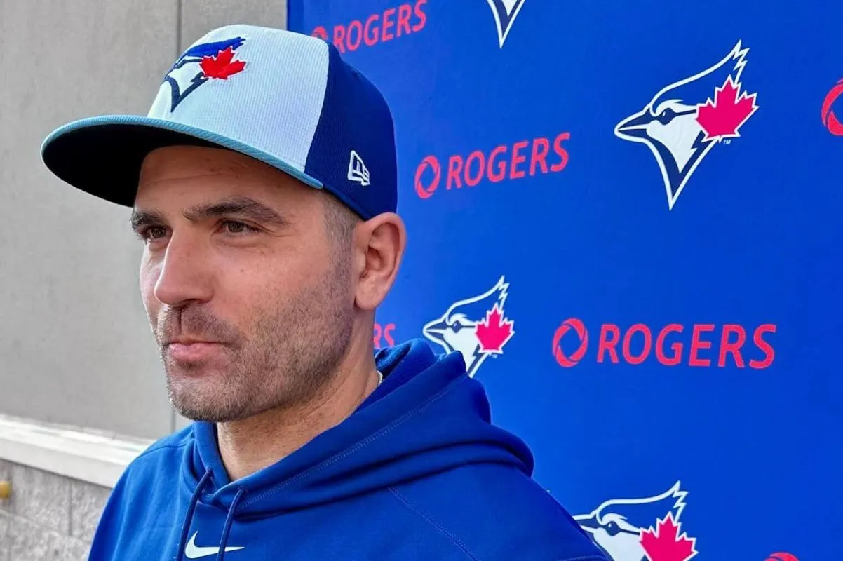 Joey Votto of the Blue Jays answering questions at Spring Training.
