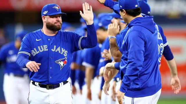 Blue Jays Manager John Schneider celebrates win with his team.