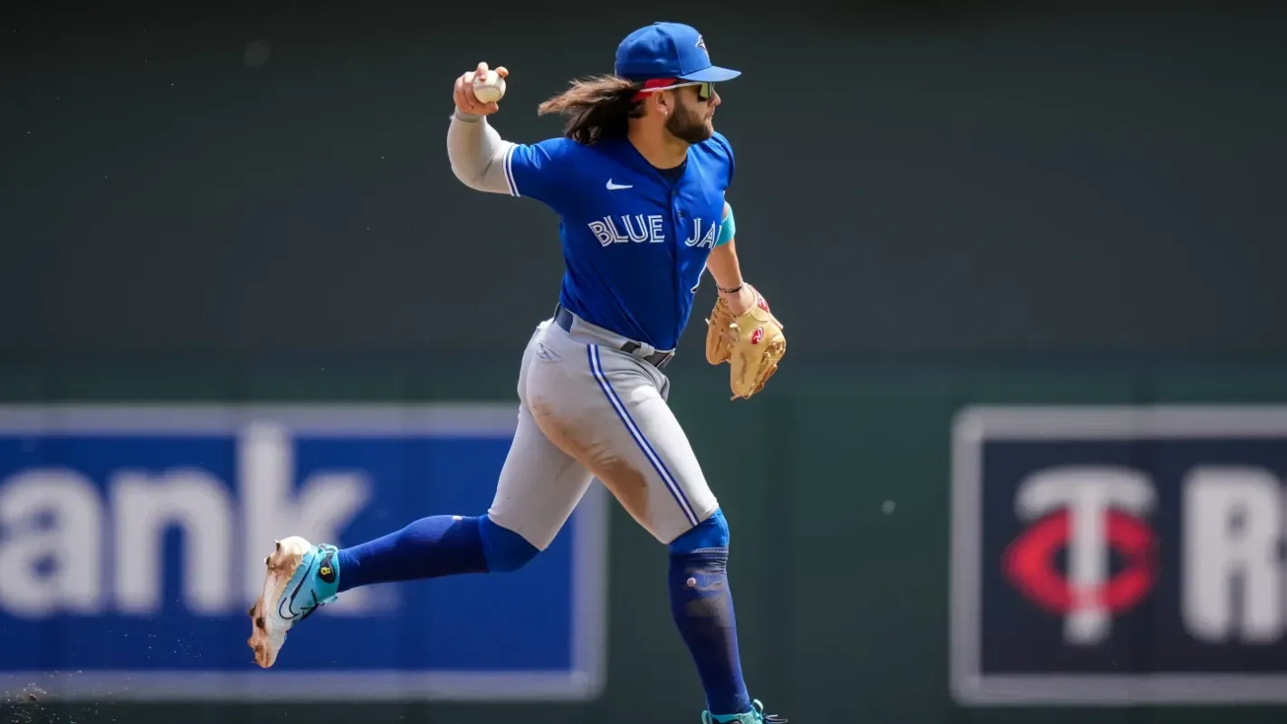 Bichette mid-throw for the Blue Jays