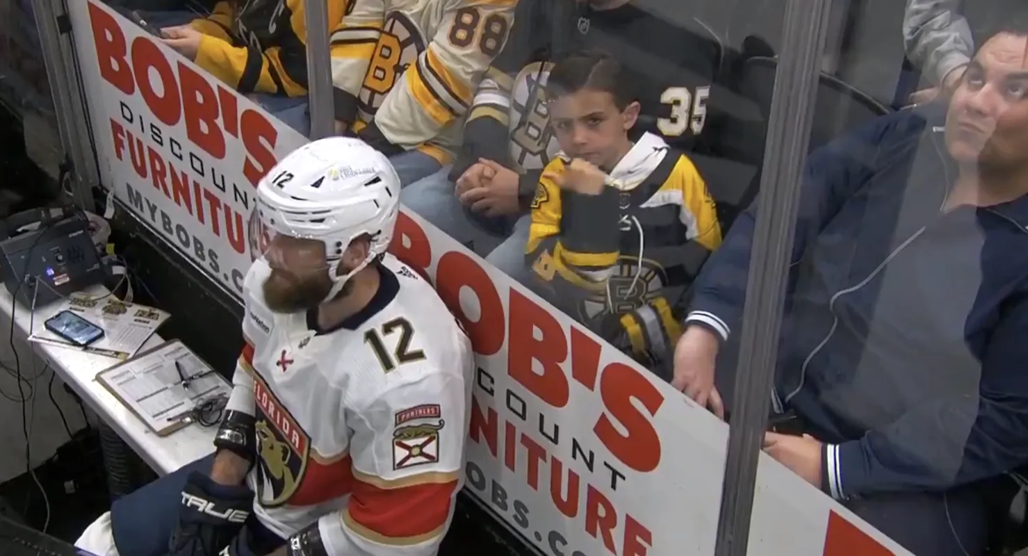 A young Boston Bruins fan tauntin Jonah Gadjovich