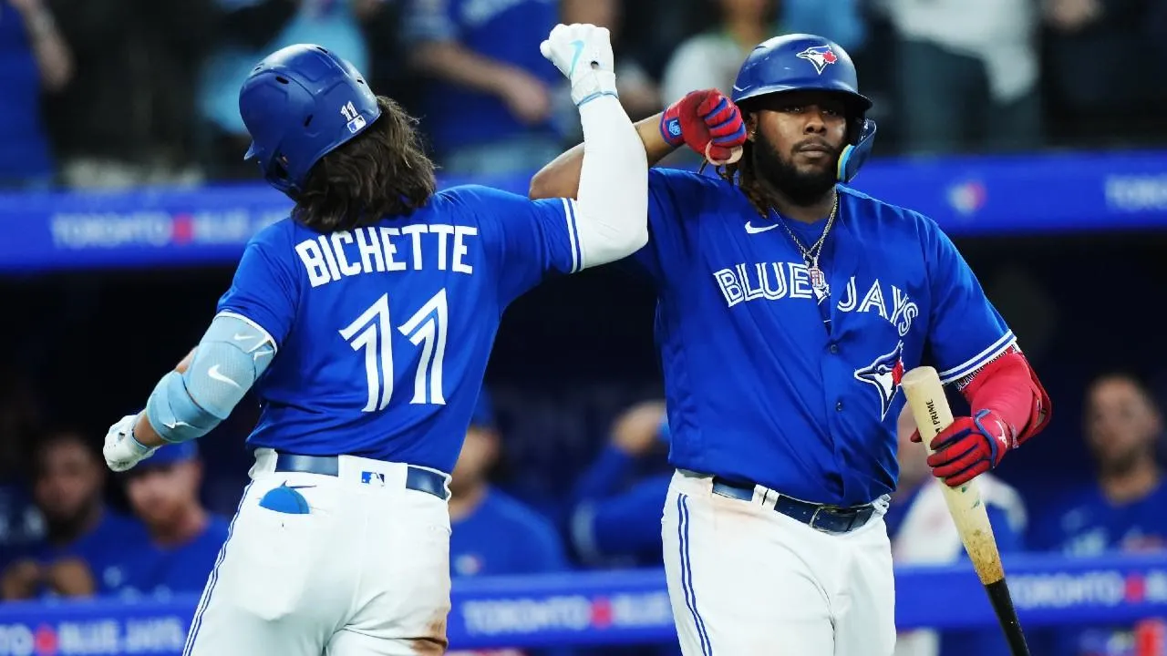 Bichette and Vladdy celebrating in unison.