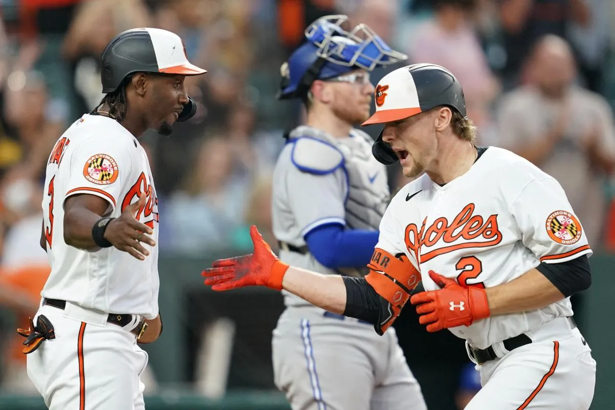 Orioles SS Gunnar Henderson celebrating a home run against the Toronto Blue Jays.
