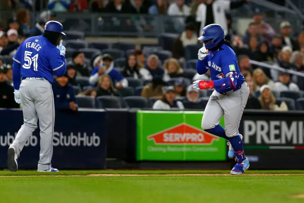 3rd Base Coach Carlos Febles and Vladimir Guerrero Jr.