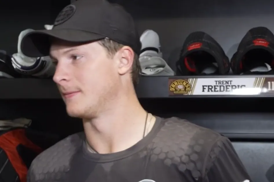 Boston Bruins forward Trent Frederic speaking to the media
