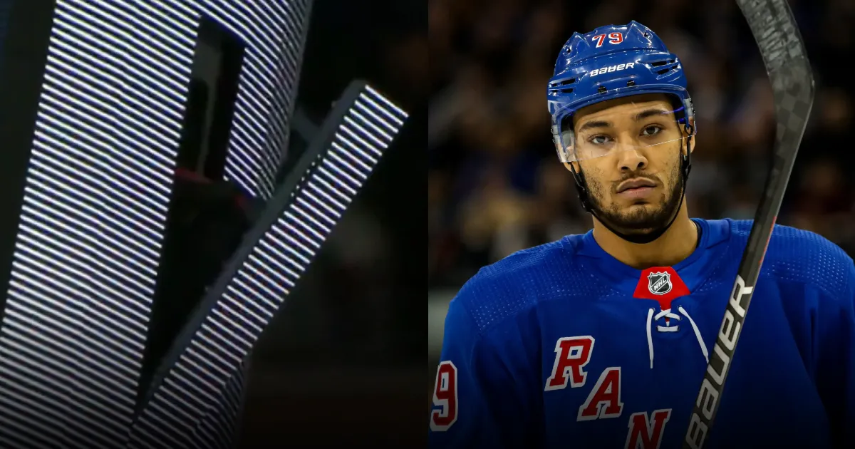 A piece of the scoreboard in Madison Square Garden dangling after Rangers defenseman K'Andre Miller hit it with the puck on accident