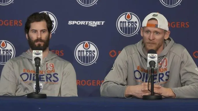 Adam Henrique and Corey Perry of the Edmonton Oilers speak to the media