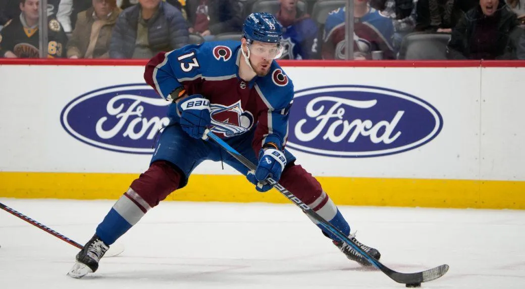 Colorado Avalanche forward Valeri Nichushkin skating with the puck during a home game in the NHL.