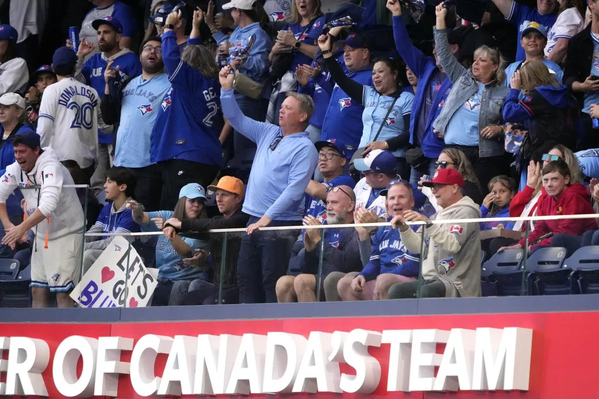 Toronto Blue Jays fans celebrate in the third inning against the Seattle Mariners during game two of the ALCS round for the 2025 MLB playoffs at Rogers Centre.