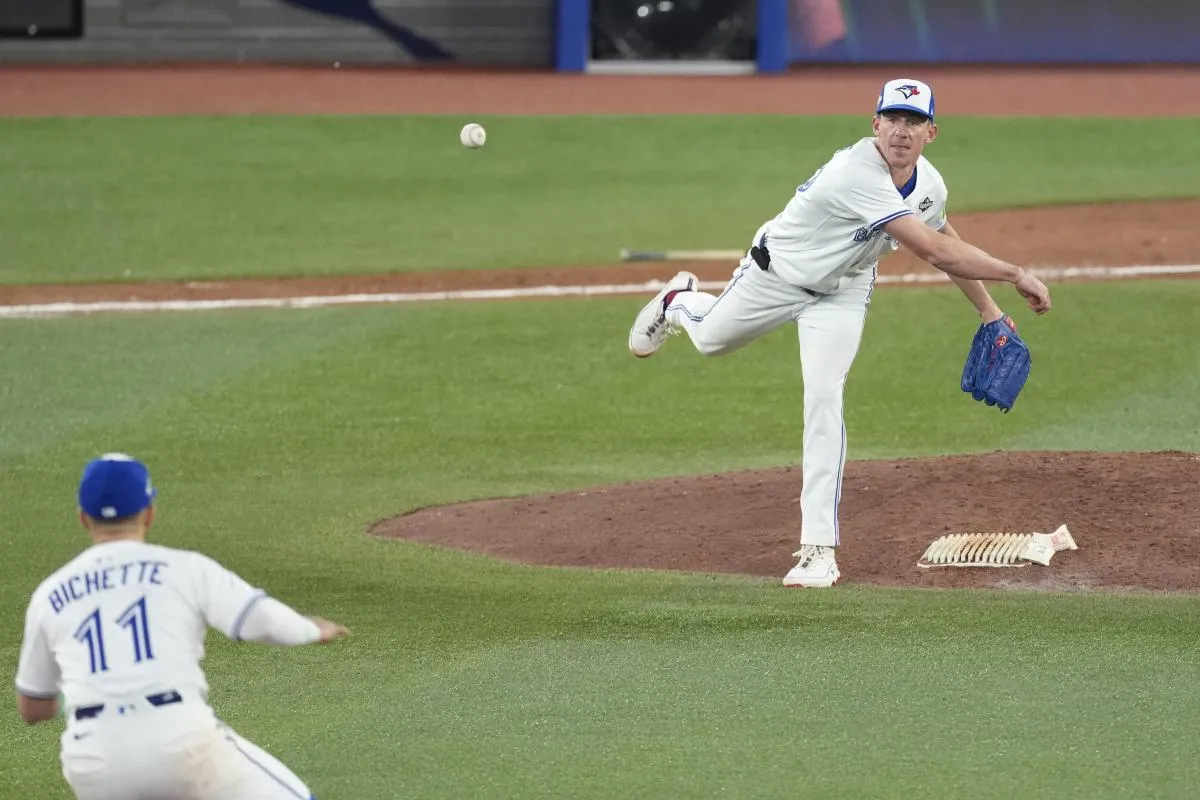 Toronto Blue Jays pitcher Chris Bassitt (40) throws to second for an out against the Los Angeles Dodgers in the sixth inning during game seven of the 2025 MLB World Series at Rogers Centre.