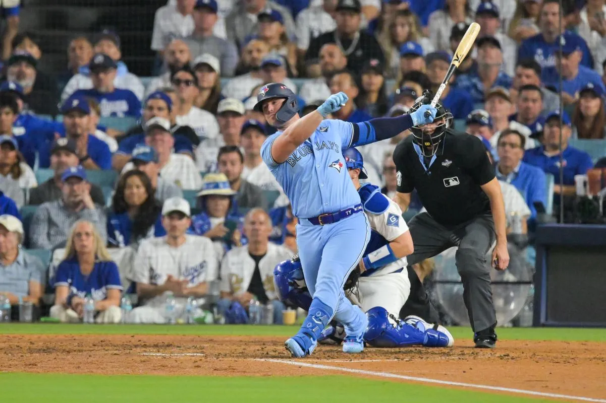 Toronto Blue Jays first baseman Ty France (2) hits an RBI single during the seventh inning against the Los Angeles Dodgers during game four of the 2025 MLB World Series at Dodger Stadium.