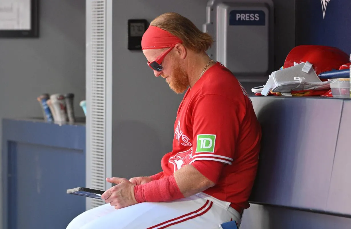 Toronto Blue Jays designated hitter Justin Turner (2) looks at video replays on a tablet after striking out against the Houston Astros in the sixth inning at Rogers Centre.