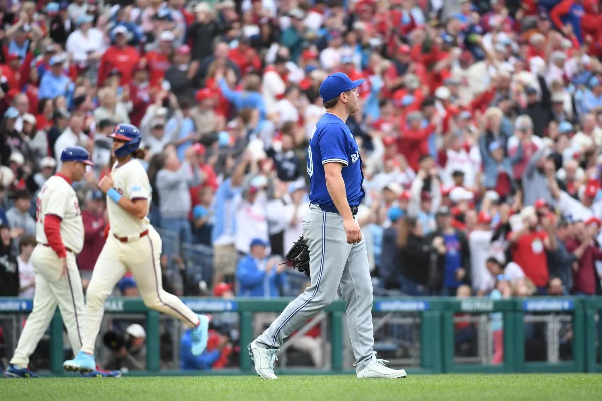 Toronto Blue Jays pitcher Erik Swanson (50) reacts after allowing a grand slam home run during the sixth inning against the Philadelphia Phillies at Citizens Bank Park.
