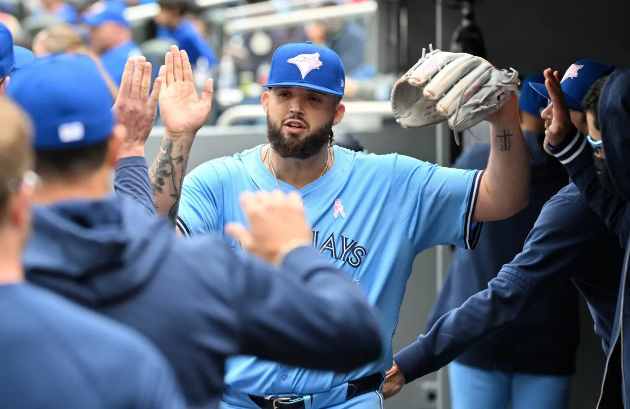 Toronto Blue Jays pitcher Alek Manoah (6) is greeted by team mates in the dugout after completing the sixth inning against the Minnesota Twins at Rogers Centre.
