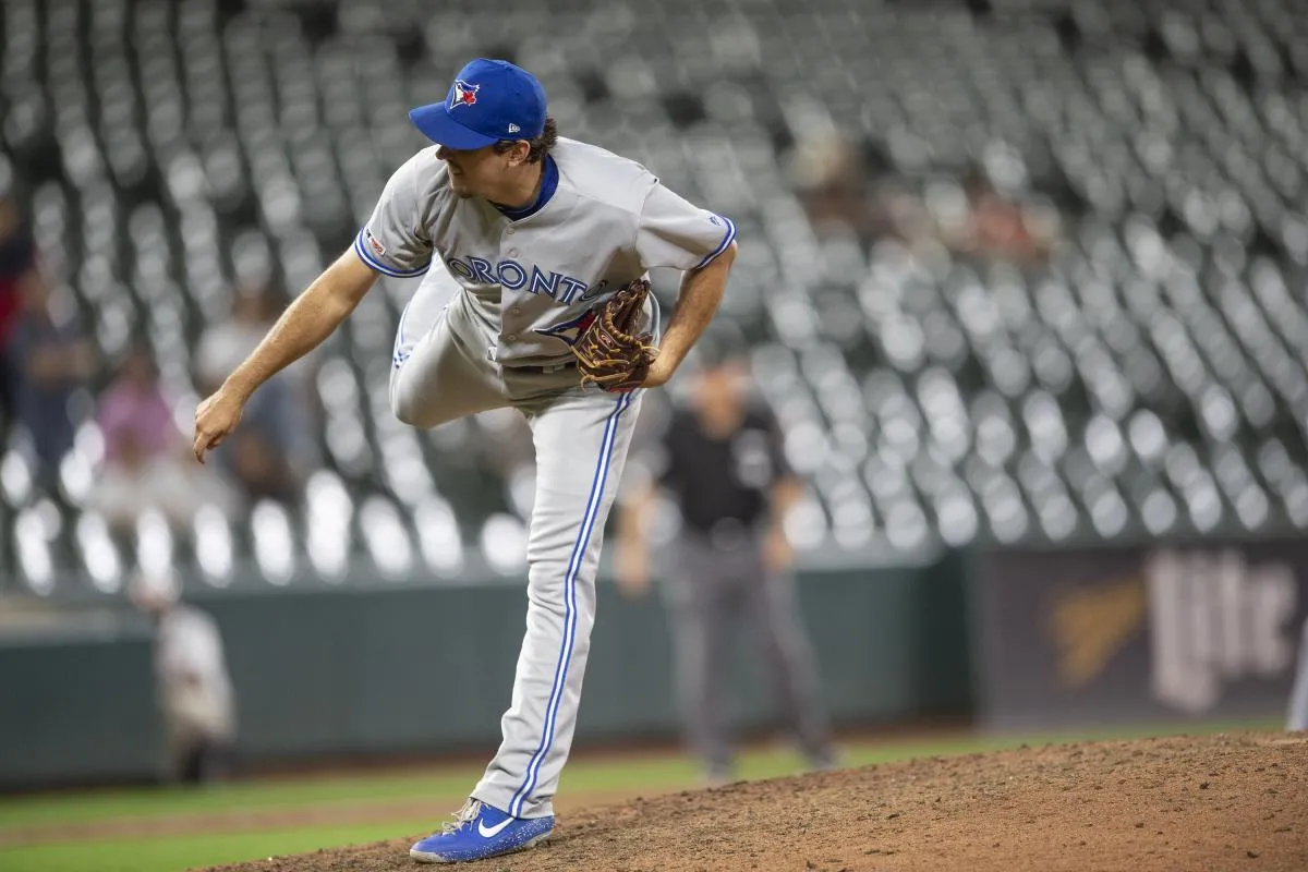 Toronto Blue Jays relief pitcher Derek Law (64) delivers a pitch during the ninth inning against the Baltimore Orioles at Oriole Park at Camden Yards.
