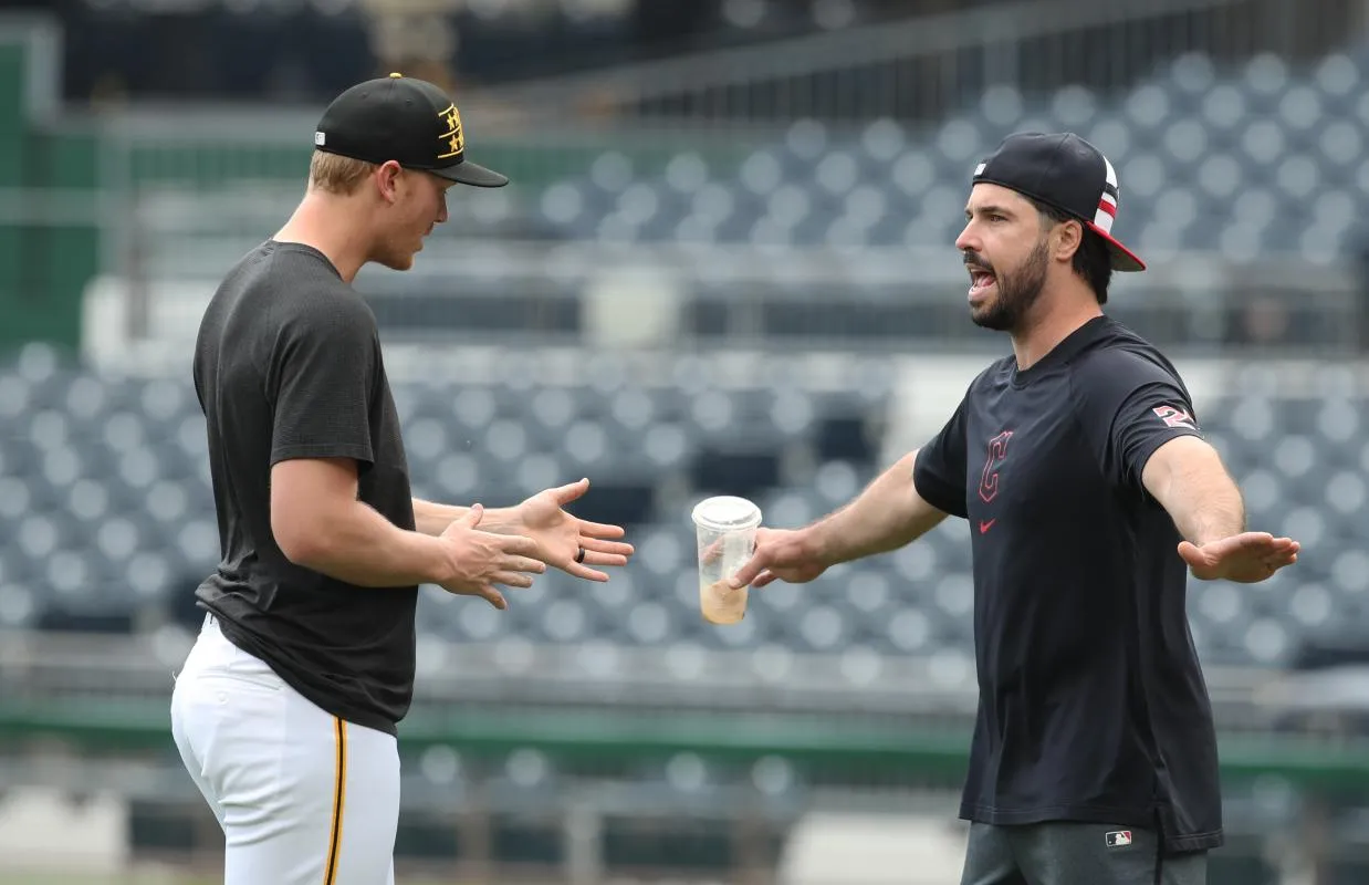 Pittsburgh Pirates starting pitcher Mitch Keller (23) and Cleveland Guardians catcher Austin Hedges (27) talk before playing at PNC Park.