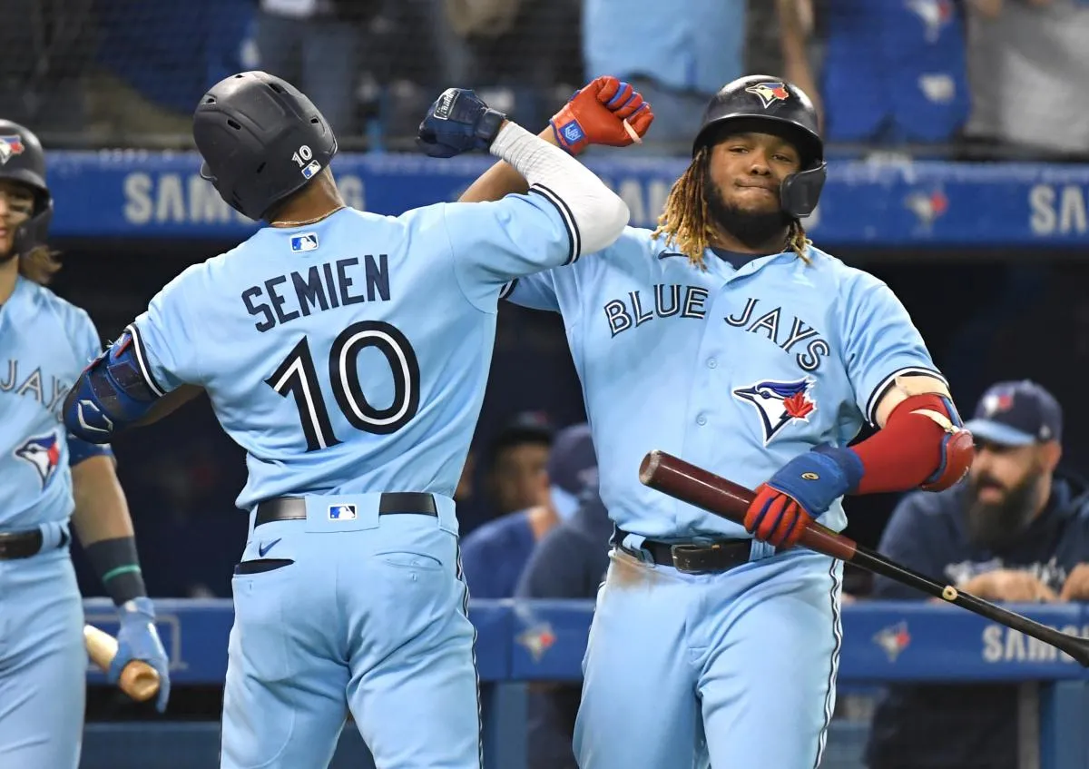 Toronto Blue Jays second baseman Marcus Semien (10) is greeted by first baseman Vladimir Guererro Jr. (27) after hitting a solo home run against Baltimore Orioles in the fifth inning at Rogers Centre.