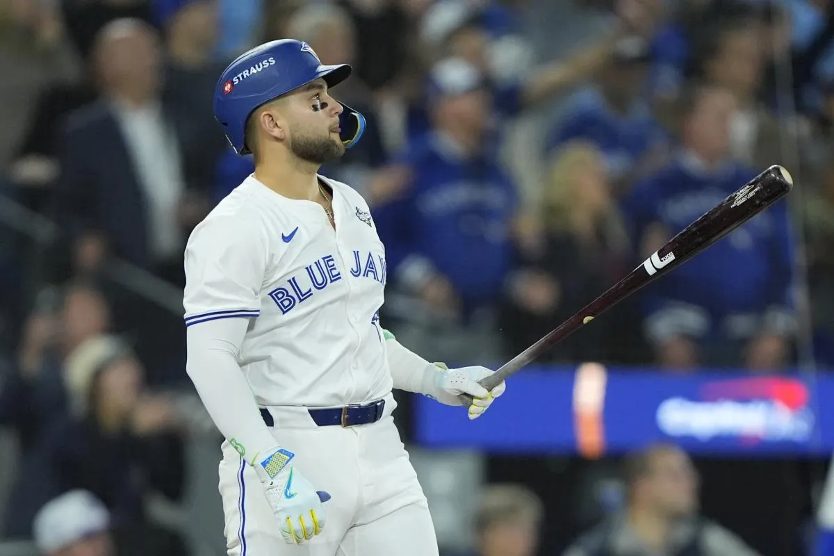 Toronto Blue Jays designated hitter Bo Bichette (11) hits a three run home run against the Los Angeles Dodgers in the third inning during game seven of the 2025 MLB World Series at Rogers Centre.