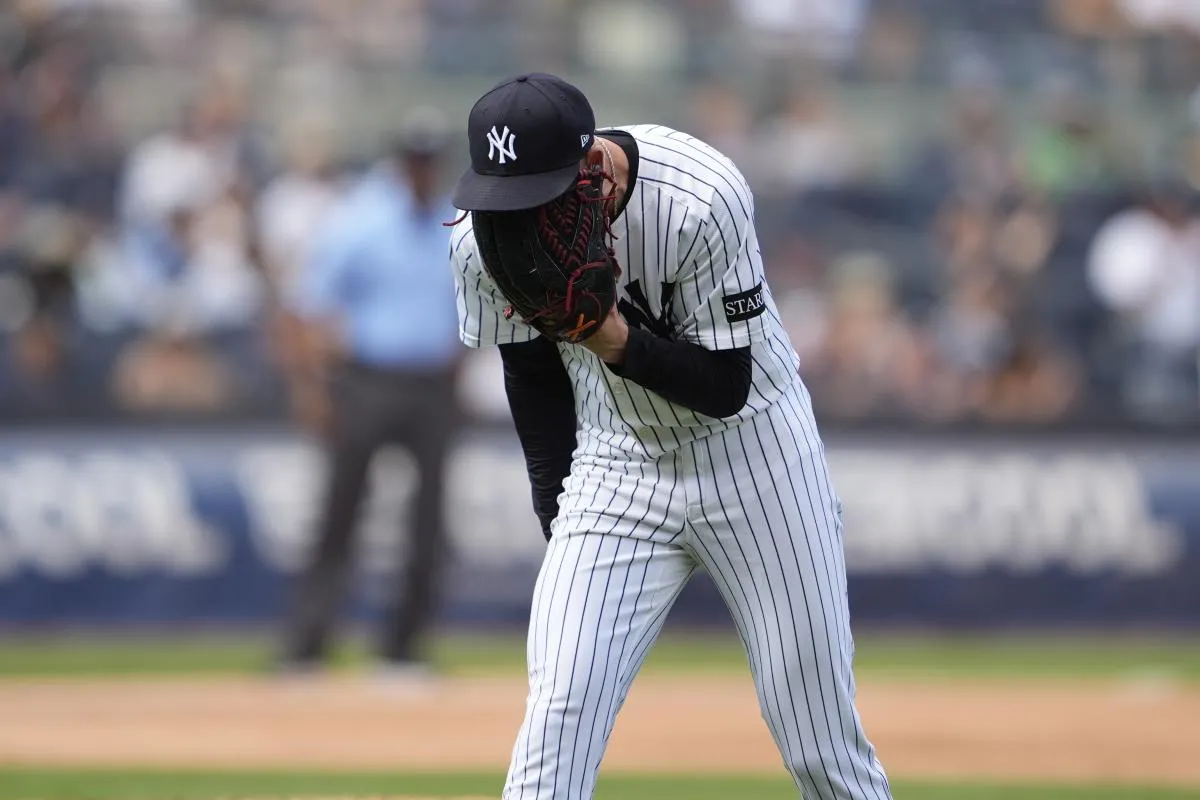 New York Yankees pitcher Luke Weaver (30) reacts to getting a strikeout to end the inning against the Chicago Cubs during the eighth inning at Yankee Stadium.