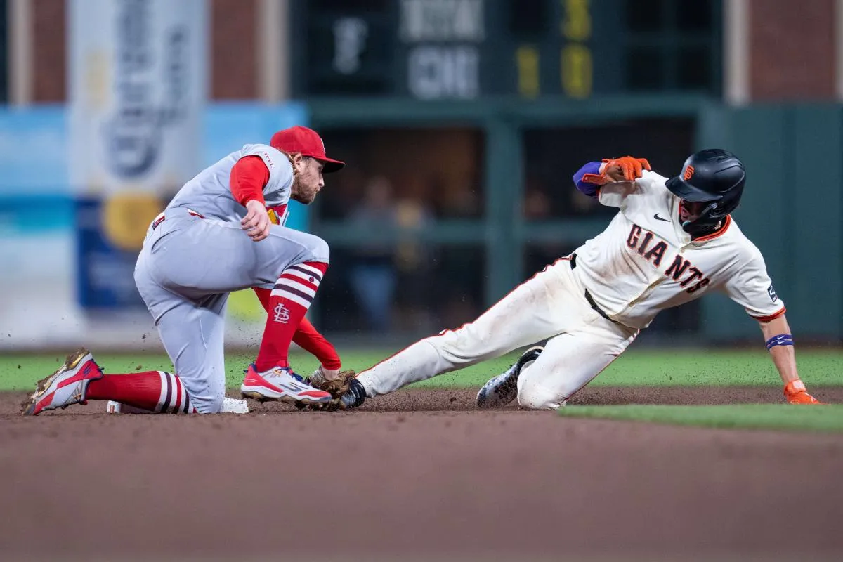 San Francisco Giants shortstop Willy Adames (2) is caught stealing second base by St. Louis Cardinals second baseman Brendan Donovan (33) during the fifth inning at Oracle Park.