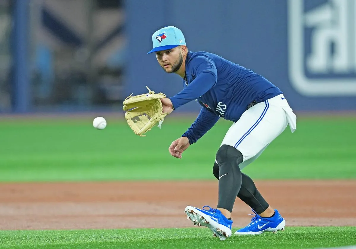 Toronto Blue Jays shortstop Bo Bichette (11) fields balls during batting practice before a game against the Baltimore Orioles at Rogers Centre.