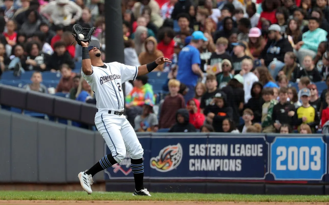 Akron RubberDucks first baseman Jorge Burgos (24) gets under a fly ball hit by Altoona Curve centerfielder Mitch Jebb (19) during the sixth inning of an MiLB baseball game at Canal Park on Tuesday, May 20, 2025, in Akron, Ohio.