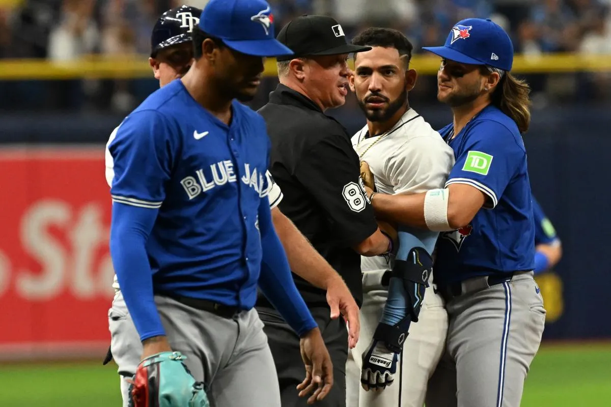 Tampa Bay Rays shortstop Jose Caballero (7) stares at Toronto Blue Jays relief pitcher Genesis Cabrera (92) after they collide in the seventh inning of the game at Tropicana Field.