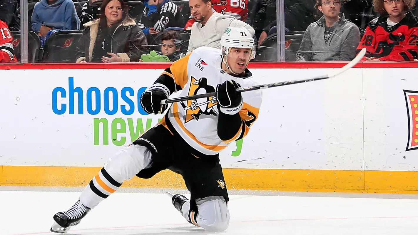 Pittsburgh Penguins' Evgeni Malkin takes a shot on his knee
