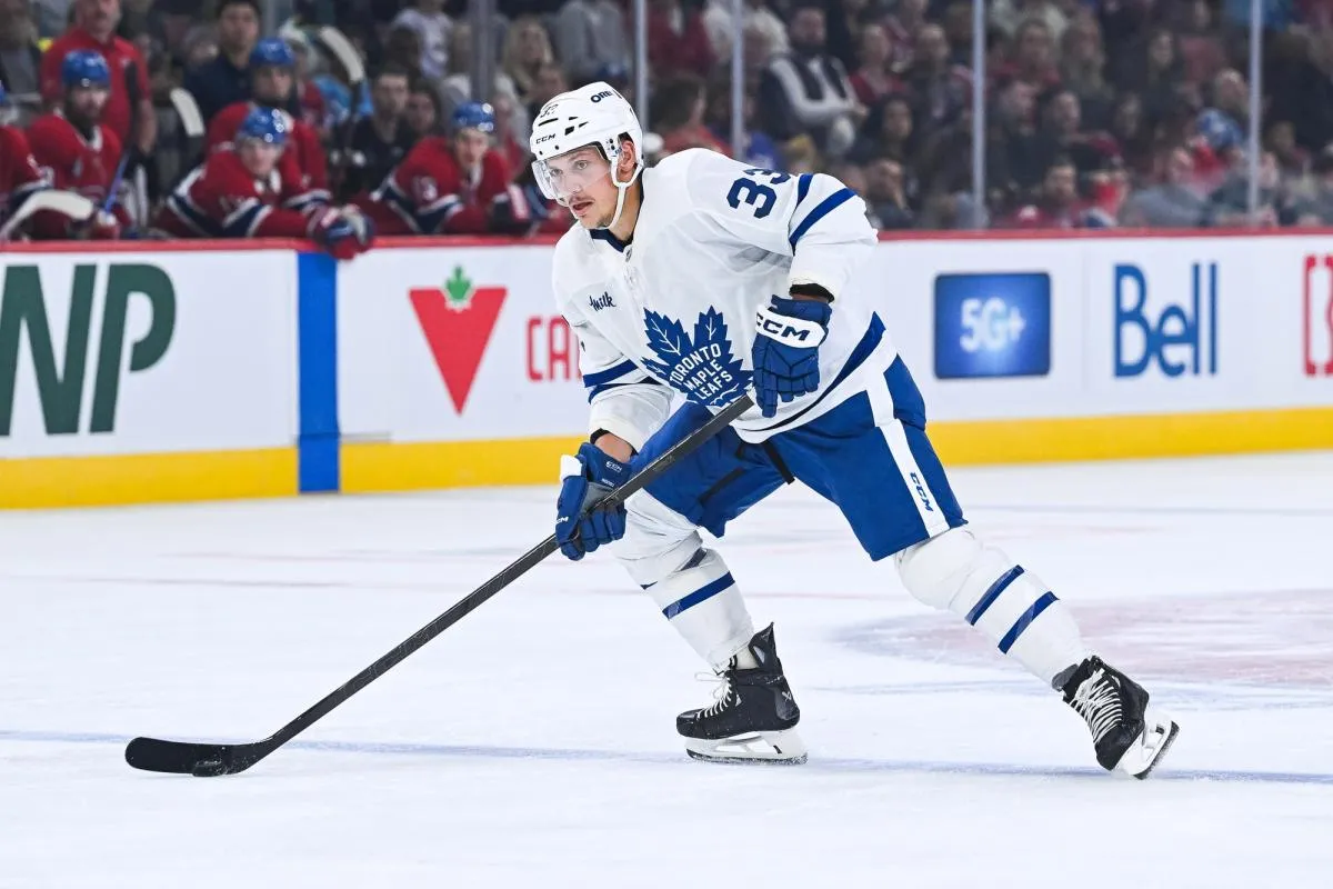 Toronto Maple Leafs defenseman Matt Benning (33) plays the puck against the Montreal Canadiens during the second period at Bell Centre.