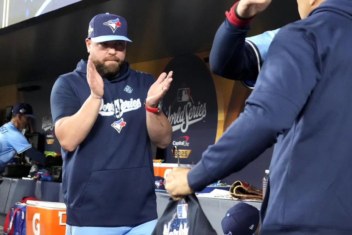 Toronto Blue Jays manager John Schneider (14) reacts in the dugout before game six of the 2025 MLB World Series between the Toronto Blue Jays and the Los Angeles Dodgers at Rogers Centre.