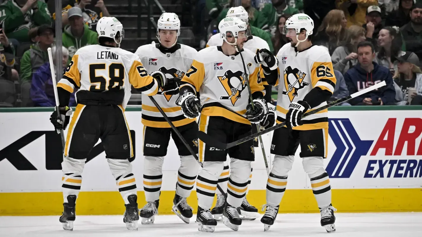 Pittsburgh Penguins players celebrate a goal