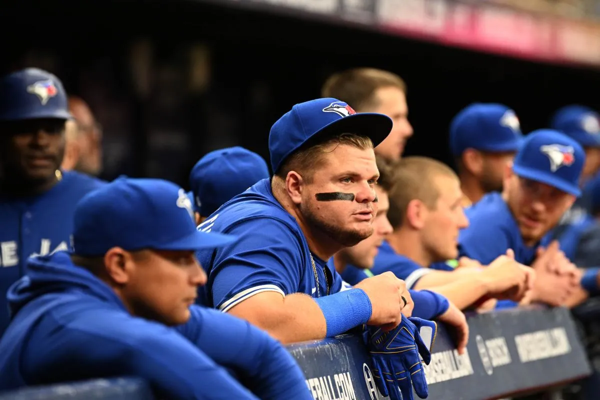 Toronto Blue Jays designated hitter Daniel Vogelbach (20) and hitting coach Guillermo Martinez look on during the first inning of the game against the Tampa Bay Rays at Tropicana Field.