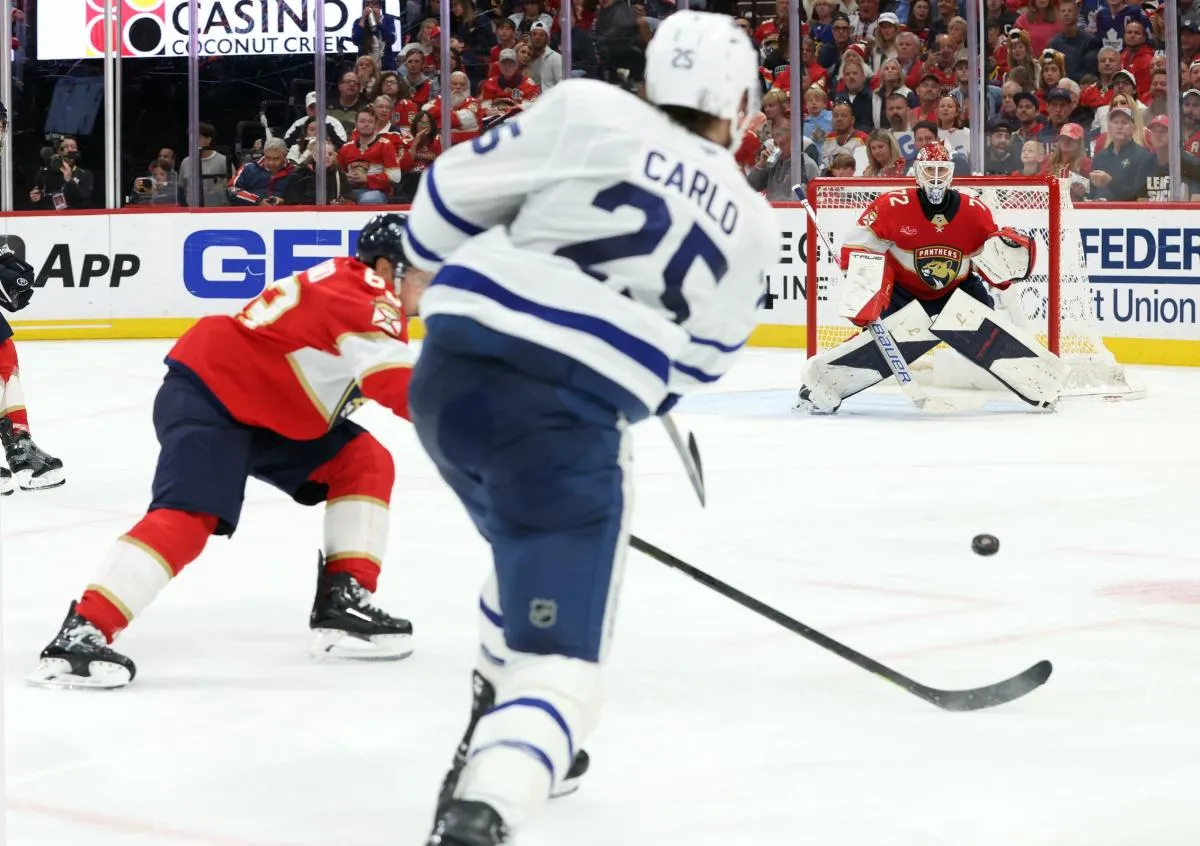 Toronto Maple Leafs defenseman Brandon Carlo (25) shoots as Florida Panthers goaltender Sergei Bobrovsky (72) looks at the puck during the third period in game four of the second round of the 2025 Stanley Cup Playoffs at Amerant Bank Arena.