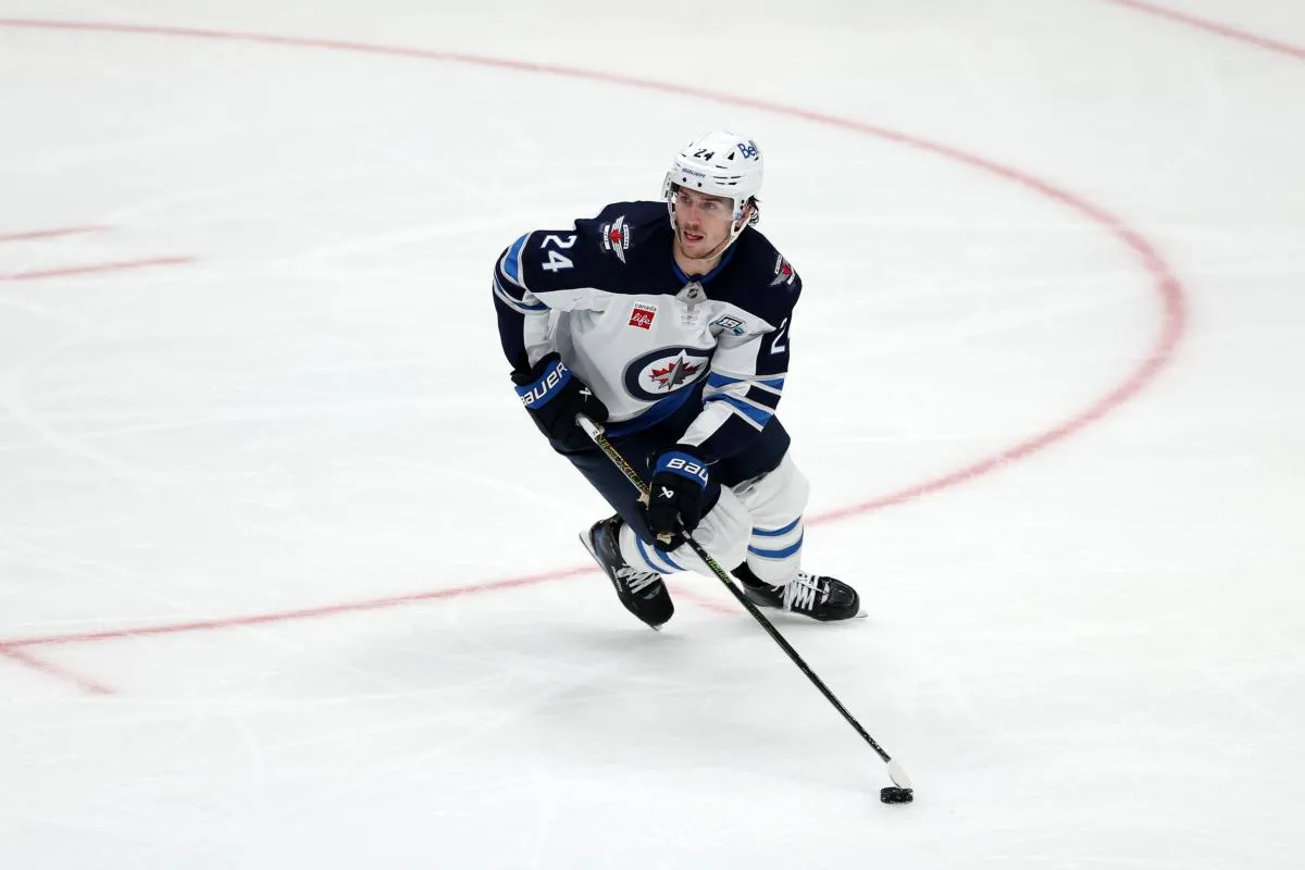 Winnipeg Jets defenseman Haydn Fleury (24) skates with the puck during the third period against the Anaheim Ducks at Honda Center.
