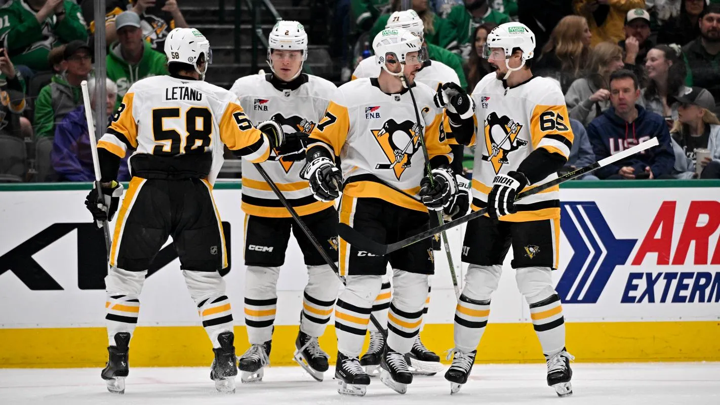 Pittsburgh Penguins defenseman Kris Letang (58) and ight wing Rutger McGroarty (2) and center Evgeni Malkin (71) and defenseman Erik Karlsson (65) celebrate after Penguins center Sidney Crosby (87) scores a power play goal against the Dallas Stars during the first period at the American Airlines Center.