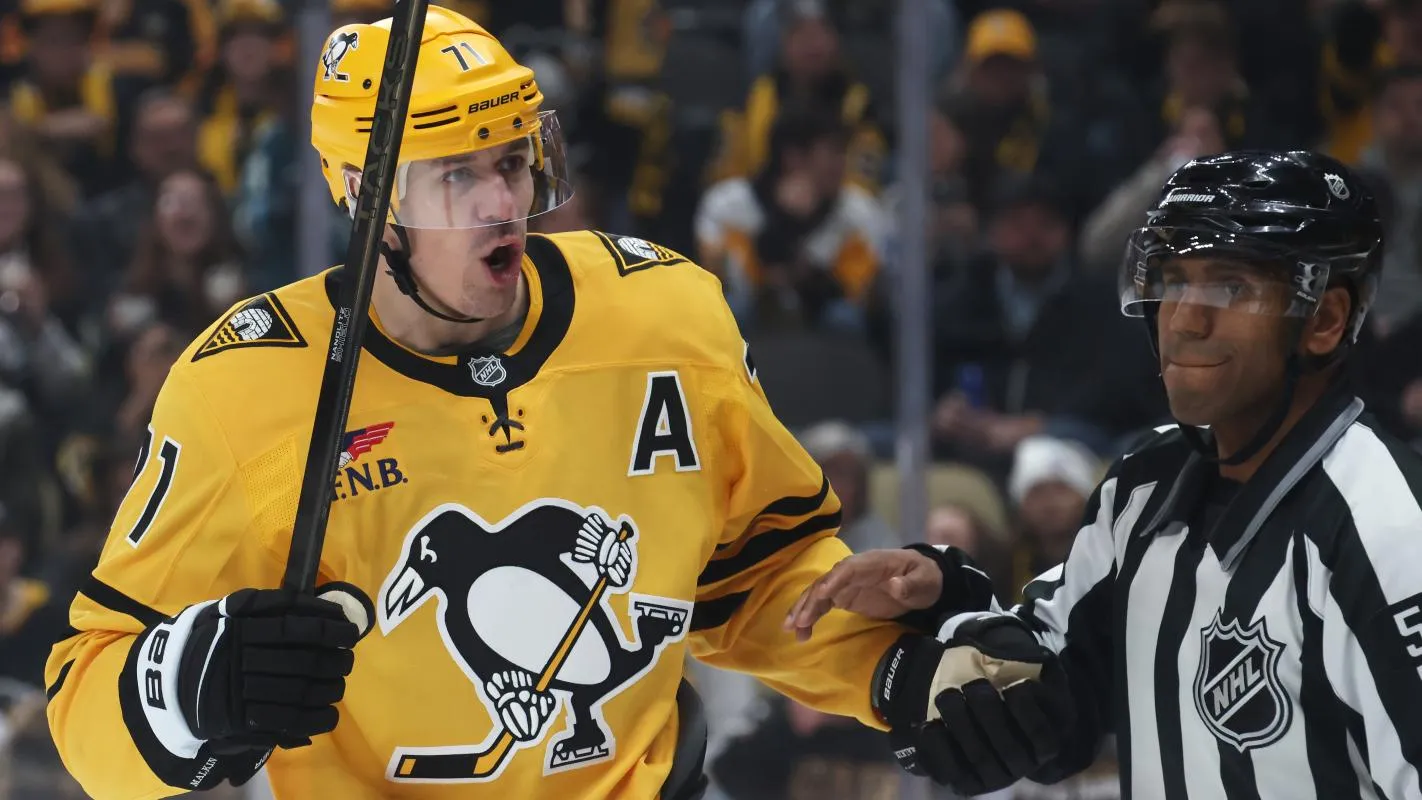 Pittsburgh Penguins center Evgeni Malkin (71) reacts to the Seattle Kraken as linesman Shandor Alphonso (52) restrains Malkin during the third period at PPG Paints Arena.