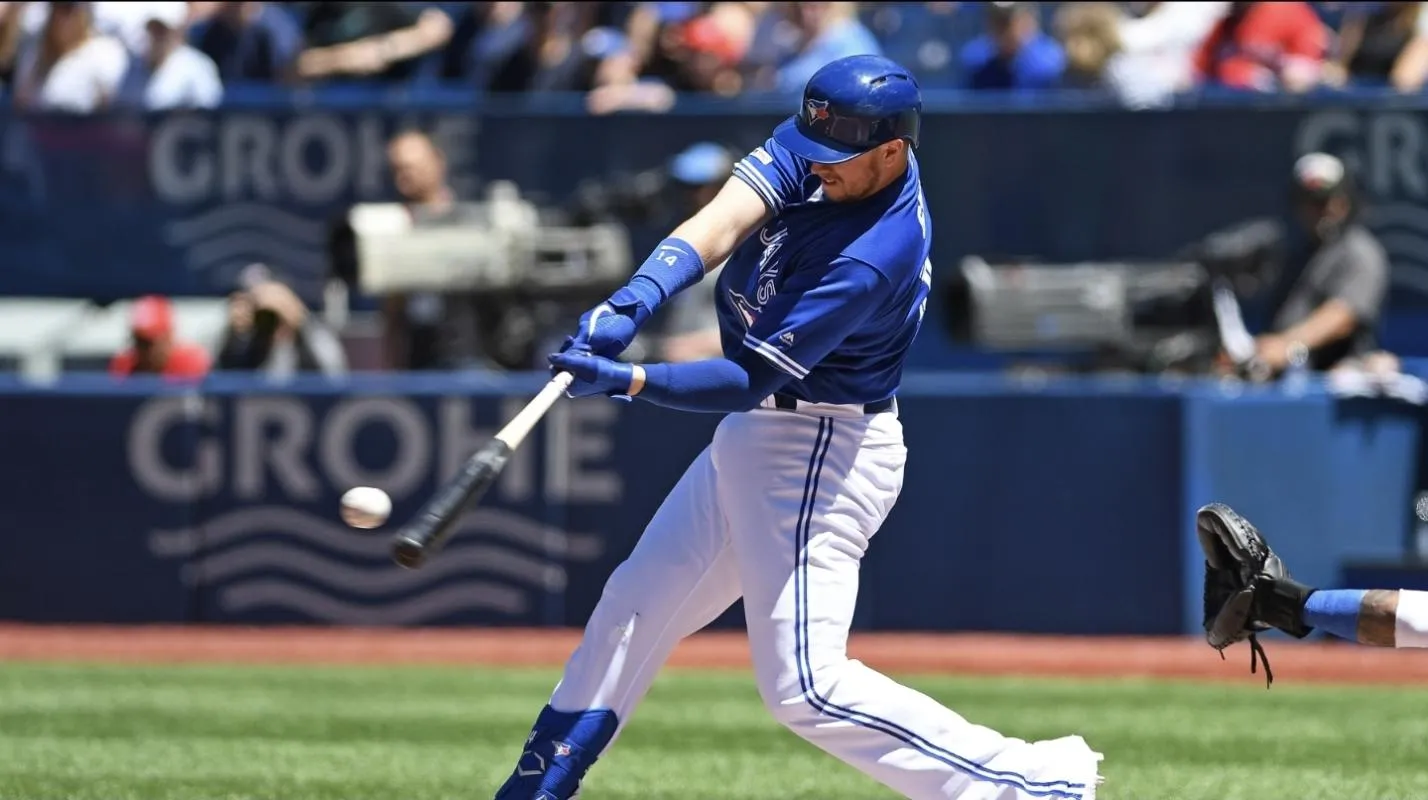 Toronto Blue Jays designated hitter Justin Smoak (14) hits a two run home run in the second inning at Rogers Centre.