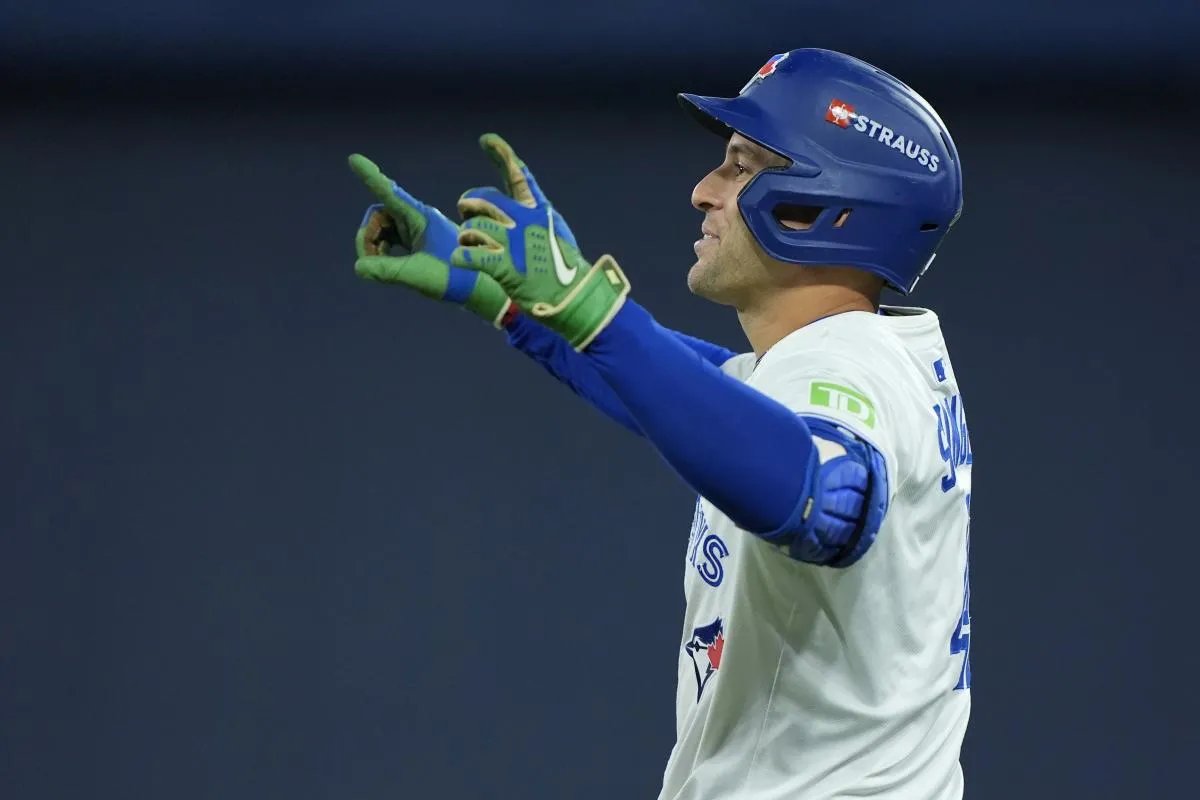 Toronto Blue Jays right fielder George Springer (4) reacts after hitting a single in the fourth inning against the Los Angeles Dodgers during game seven of the 2025 MLB World Series at Rogers Centre.