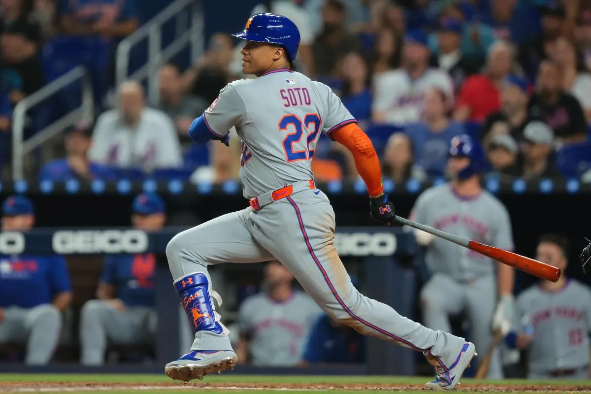 New York Mets right fielder Juan Soto (22) hits a single against the Miami Marlins during the third inning at loanDepot Park.