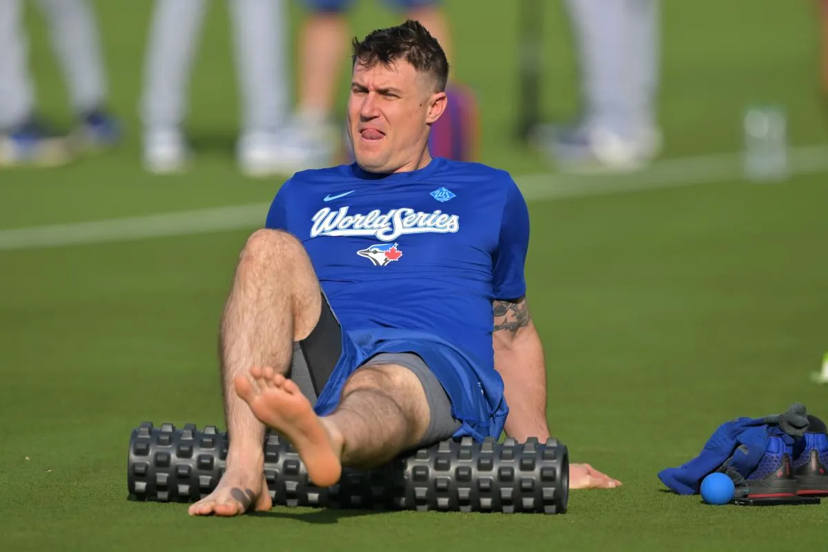 Toronto Blue Jays catcher Tyler Heineman (55) stretches during World Series workouts prior to game 3 against the Los Angeles Dodgers at Dodger Stadium.
