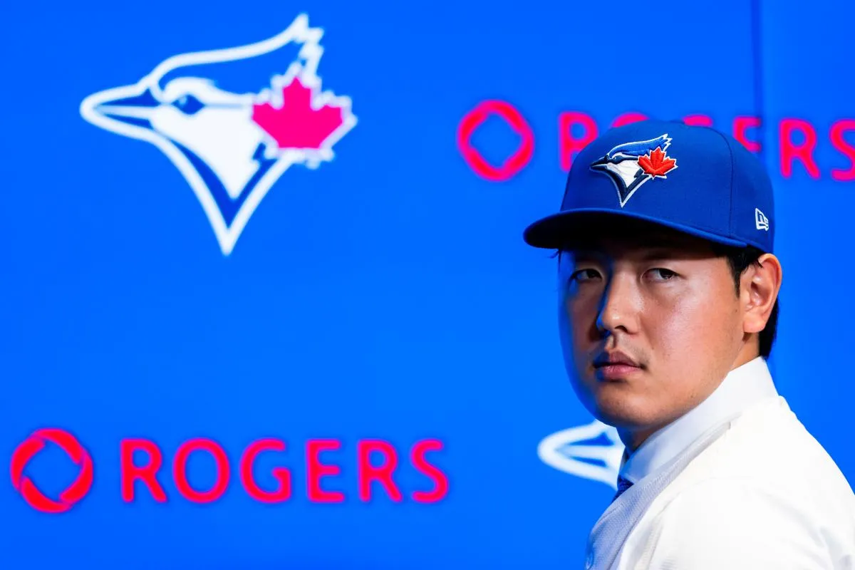 Toronto Blue Jays Kazuma Okamoto speaks to the media during the press conference at Rogers Centre.