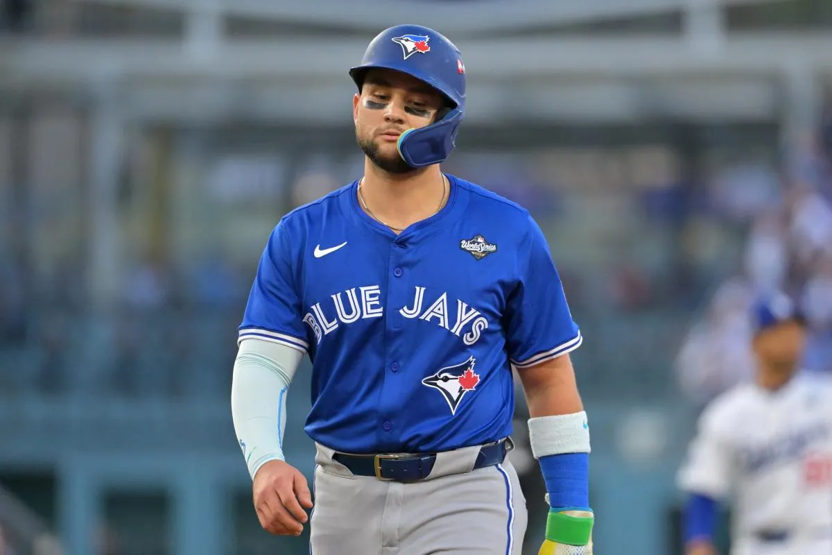 Toronto Blue Jays second baseman Bo Bichette (11) reacts in the second inning against the Los Angeles Dodgers during game three of the 2025 MLB World Series at Dodger Stadium.