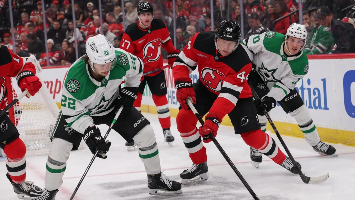 New Jersey Devils defenseman Dennis Cholowski (44) plays the puck away from Dallas Stars center Mavrik Bourque (22) during the first period at Prudential Center.