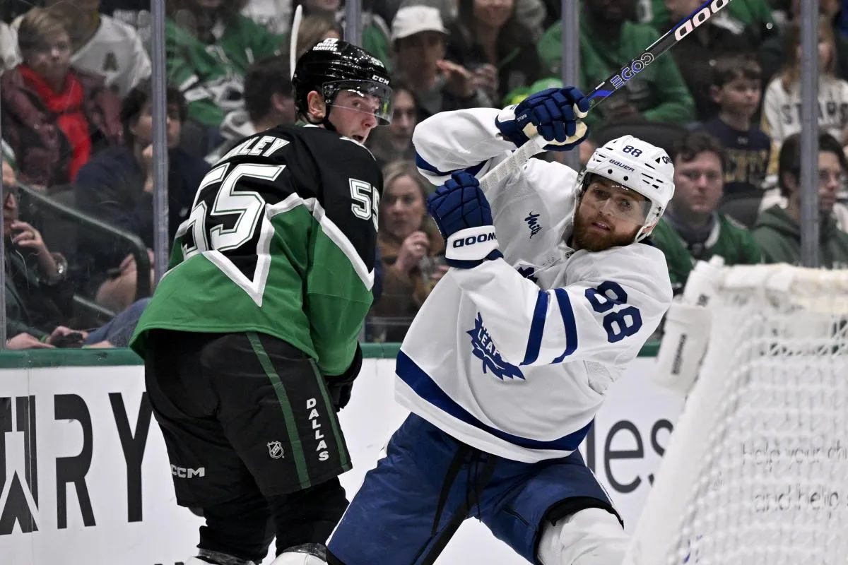 Dallas Stars defenseman Thomas Harley (55) and Toronto Maple Leafs right wing William Nylander (88) chase the puck during the first period at the American Airlines Center.