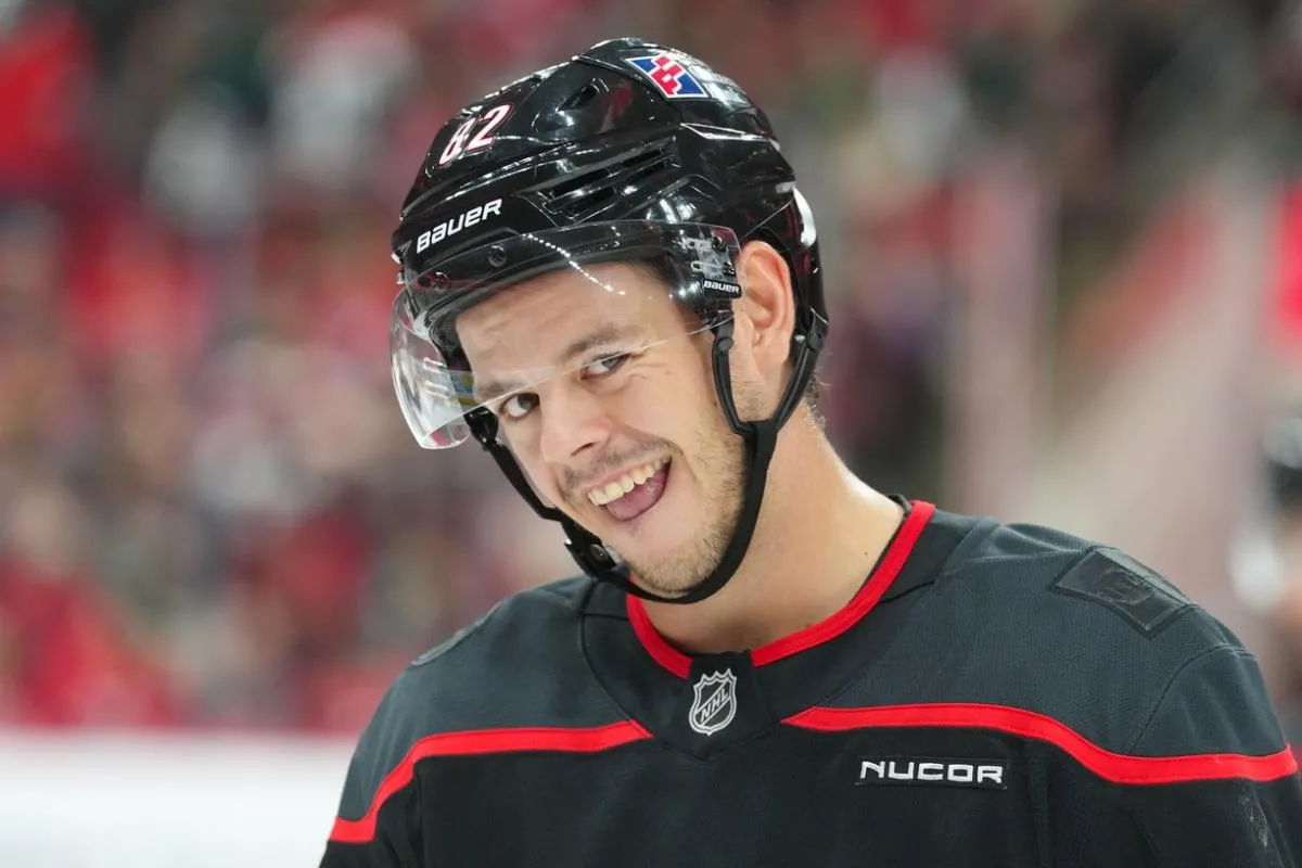 Carolina Hurricanes center Jesperi Kotkaniemi (82) smiles against the Washington Capitals during the first period at Lenovo Center.