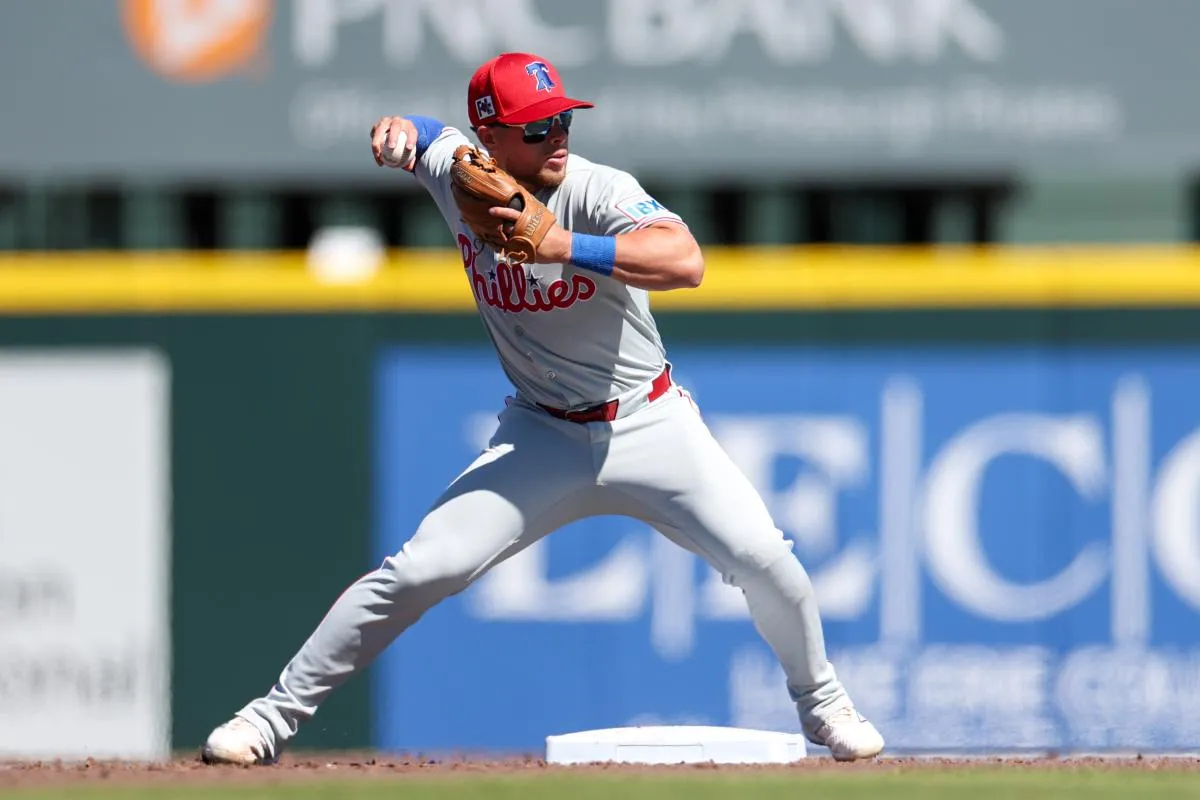 Philadelphia Phillies second baseman Rafael Lantigua (83) throws to first base against the Pittsburgh Pirates in the fourth inning during spring training at LECOM Park.