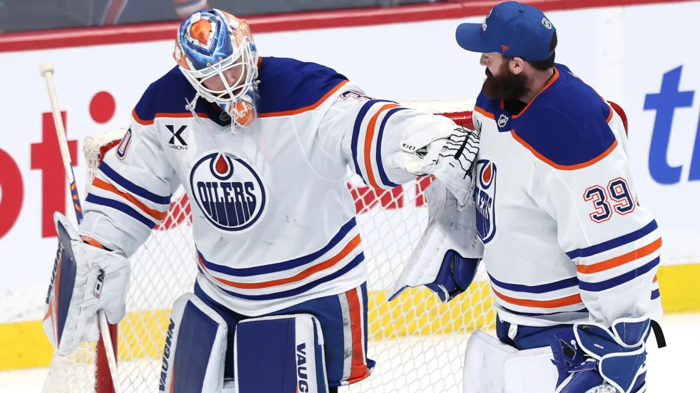 Edmonton Oilers goaltender Calvin Pickard (30) and Edmonton Oilers goaltender Connor Ingram (39) celebrate their victory over the Winnipeg Jets at Canada Life Centre.